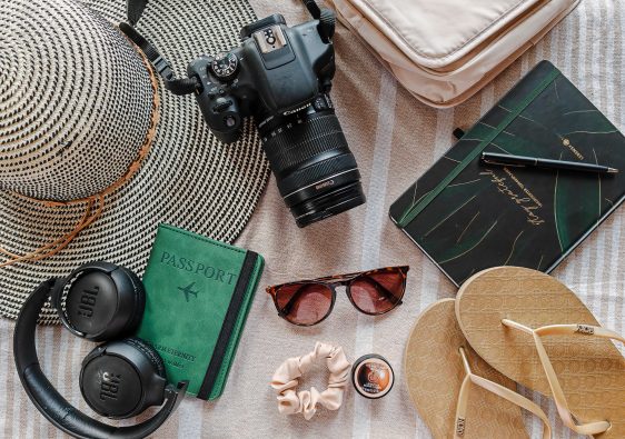 Flat Lay of essential travel gear and camera equipment for a trip to Thailand