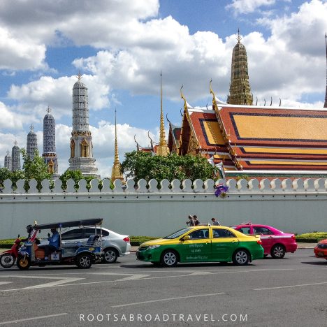 Contrast of Bangkok's old temples with its modern streets with colorful tuktuks & cabs