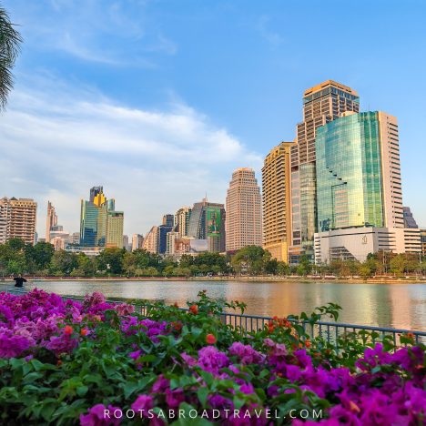 Lake at Benchakitti Park in Bangkok with towering buildings in the back