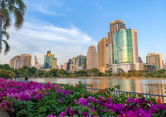 Lake at Benchakitti Park in Bangkok with towering buildings in the back
