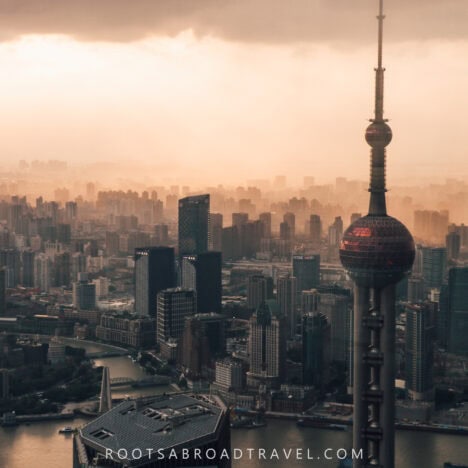 City skyline view with the Oriental Pearl tower in the foreground during sunset from Shanghai tower