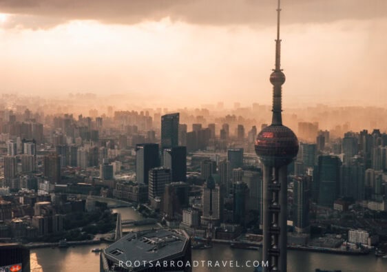 City skyline view with the Oriental Pearl tower in the foreground during sunset from Shanghai tower