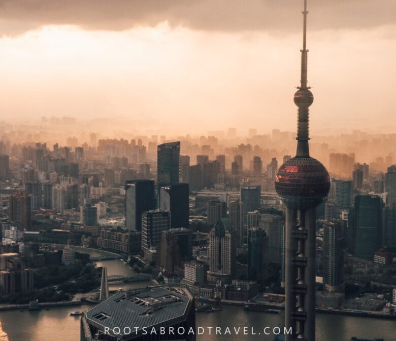 City skyline view with the Oriental Pearl tower in the foreground during sunset from Shanghai tower